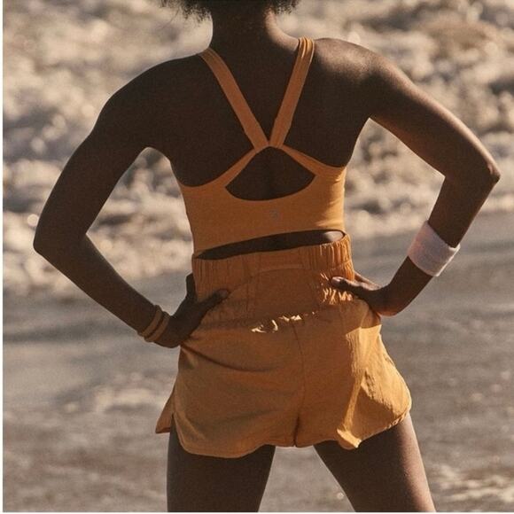 Free People | FP Movement The Way Home Runsie Romper in Marigold Yellow - Picture 4 of 7